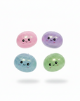 Squishy Steam Bunz display box with 6 mystery boxes and 4 glitter squishy dumplings in pink, purple, blue and green on white background