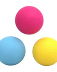 Three colorful balls (pink, blue, yellow) on a white background