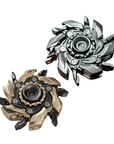 Two metallic fidget spinners on a white background