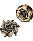 Two gold and black fidget spinners on a white background