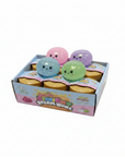 Squishy Steam Bunz display box with 6 mystery boxes and 4 glitter squishy dumplings in pink, purple, blue and green on white background