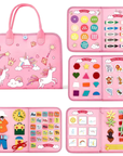 A pink children's magic bag and matching activity kit set, shown open to display various colorful educational and play items including buttons, crayons, shapes, animals, alphabet stickers, clothing pieces, and ribbons.