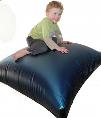 Child sitting on a small air mat
